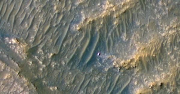 NASA Spacecraft Captures Mars Rover Like Shiny Dots