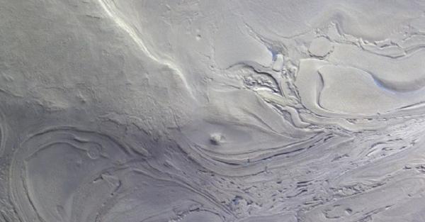 Spacecraft Sees Dazzling Whirlpool at Mars’ Lowest Point