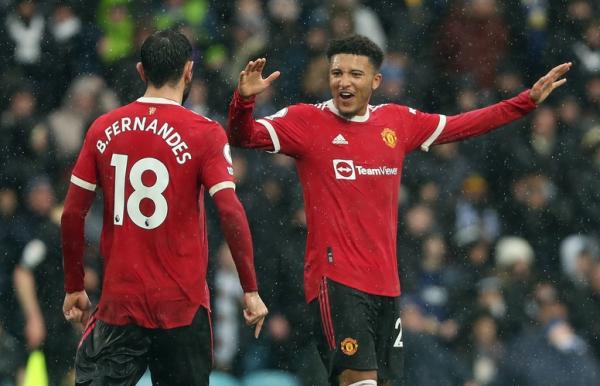 Jadon Sancho Winger Man United, Jadon Sancho merayakan gol Bruno Fernandes ke gawang Leeds United dalam laga Liga Inggris 2021/2022 di Stadion Elland Road, Minggu (20/2/2022). (Foto: REUTERS)