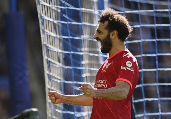 Mohamed Salah Winger Liverpool, Mohamed Salah merayakan gol ke gawang Brighton & Hove Albion dalam laga Liga Inggris 2021/2022 di Stadion American Express Community, Sabtu (12/3/2022). (Foto: REUTERS/Tony Obrien)