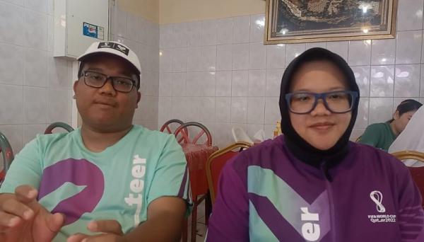 Andi Ronaldo dan Mita Yulian Sasmita Andi Ronaldo dan Mita Yulian Sasmita senang bisa menjadi volunteer Piala Dunia 2022. (Foto: MNC Portal Indonesia/Abdul Haris)
