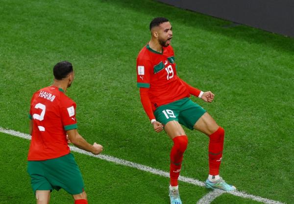 Striker Maroko, Youssef En-Nesyri merayakan gol ke gawang Portugal pada laga perempat final Piala Dunia 2022 di Stadion Al Thumama, Sabtu (10/12). (Foto: REUTERS)