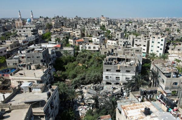 Pemandangan umum Kota Gaza, Palestina, Minggu (14/5/2023), dengan beberapa bangunan yang hancur setelah diserang Israel beberapa hari lalu. (Foto: Reuters)