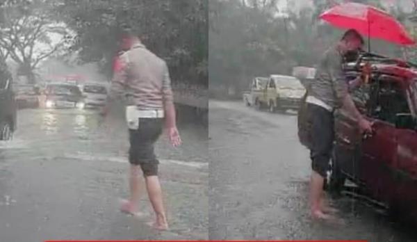 Dorong Mobil Mogok Saat hujan Lebat, Kasatlantas Polresta Malang dapat Pujian Mmasyarakat
