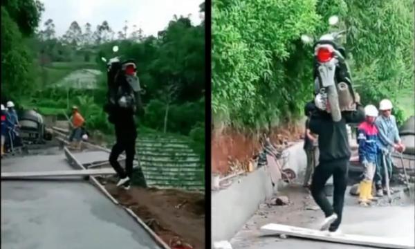 Viral! Pria Nekat Gendong Sepeda Motor di Pundak demi Hindari Jalan yang Sedang Dicor