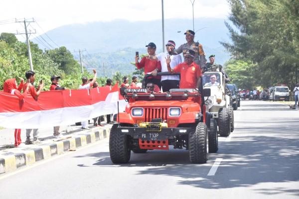 Hari Integrasi Papua ke NKRI, Kapolresta Hadiri Pembentangan Bendera Merah Putih Sepanjang 11 KM