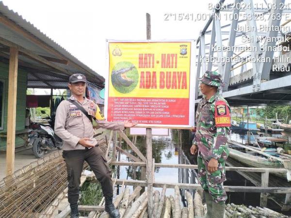 Kapolres Rohil Perintahkan Kapolsek se Rohil Pasang Spanduk Himbauan Waspadai Buaya 