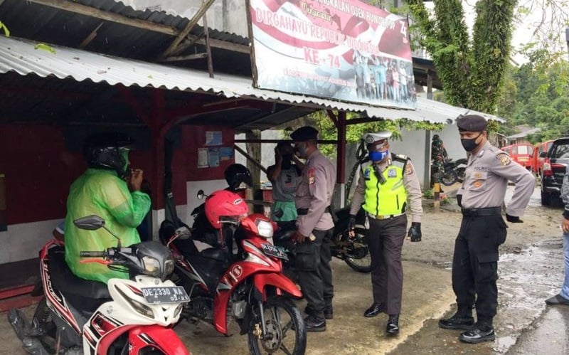 Personel Gabungan Patroli di Ambon Imbau Warga Terapkan Protokol Kesehatan Cegah Covid-19