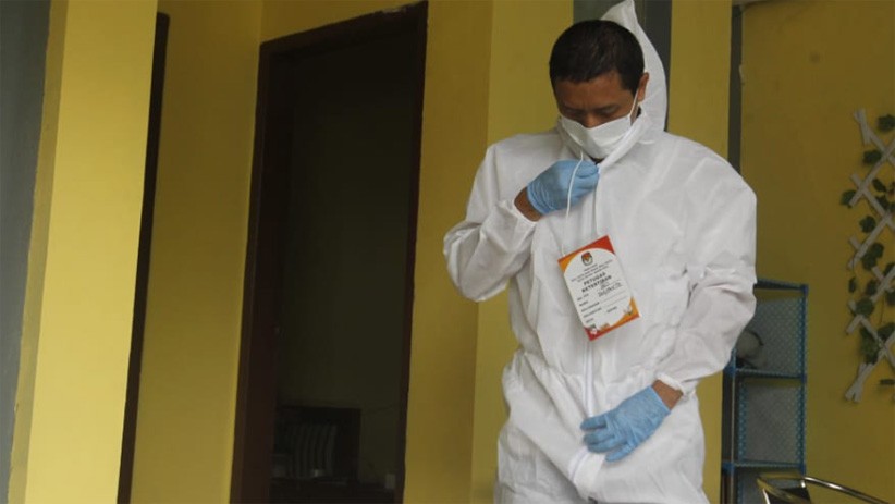 Begini Cara Pasien Isolasi Mandiri Covid-19 Memberikan Hak Suara Pilkada 2020 - Bagian 4