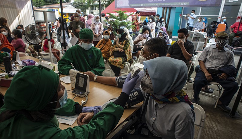 Antusiasme Masyarakat Ikuti Vaksin Covid-19 Booster Tinggi, Begini Suasananya - Bagian 2
