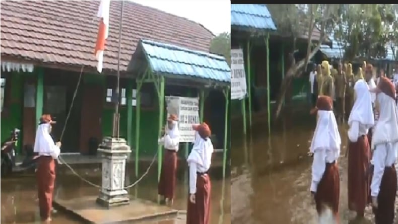 title Momen Siswa SD Tanah Laut Kalsel Upacara di Tengah Banjir Bikin Terenyuh Momen Siswa SD Tanah Laut Kalsel Upacara di Tengah Banjir Bikin Terenyuh