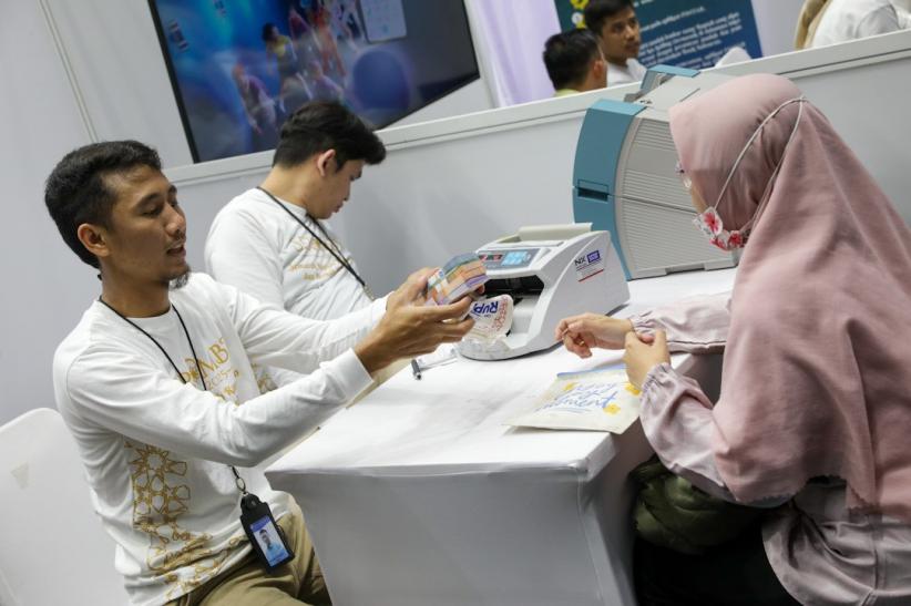 Antusiasme Warga Tukar Uang Baru yang Digelar Bank Indonesia - Bagian 4