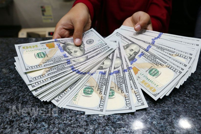 Dolar AS Melemah Tipis Setelah The Fed Tahan Suku Bunga