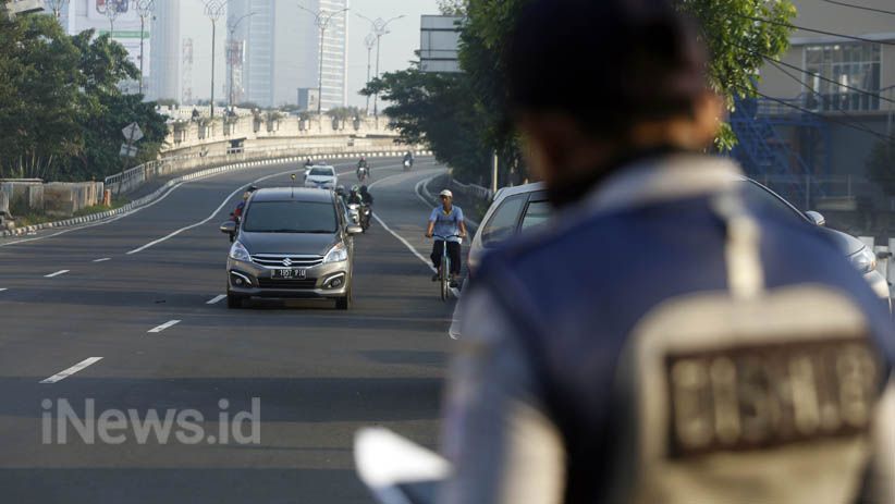 Perluasan Kebijakan Ganjil Genap di Jakarta Mulai Diuji Coba - Bagian 4