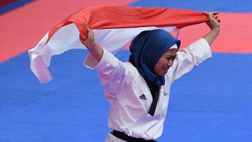 Senyum Taekwondoin Defia Rosmaniar, Sumbang Emas Pertama untuk Indonesia - Bagian 3